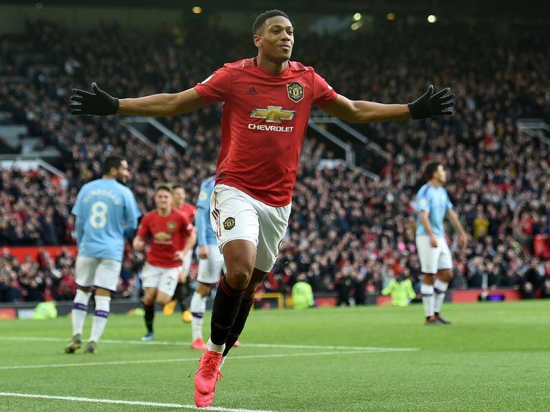 Anthony Martial celebrates scoring Manchester United's first goal in the victory over rivals City.