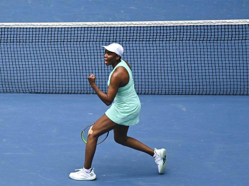 Venus Williams is into the second round of the Australian Open after beating Kirsten Flipkens.