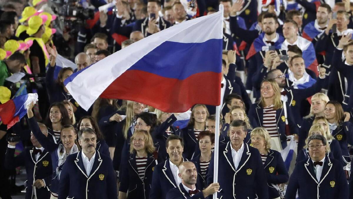Sergei Tetiukhin proudly led the Russian team in the 2016 Summer Olympics Opening Ceremony. (AP PHOTO)