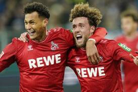 Cologne's Davie Selke (l) celebrates his match-winning goal with Luca Waldschmidt against Darmstadt. (AP PHOTO)