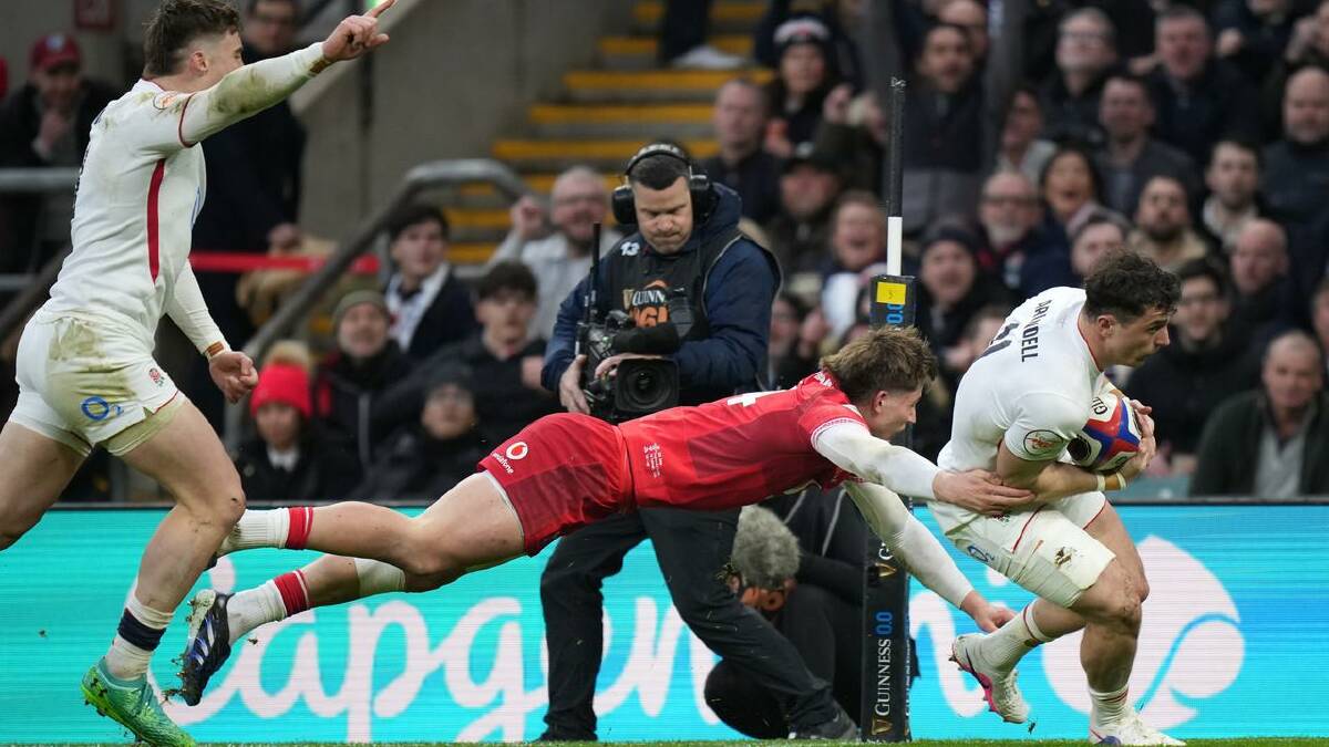 England's Henry Arundell bundles his way over for a score in the win over Wales. (AP PHOTO)