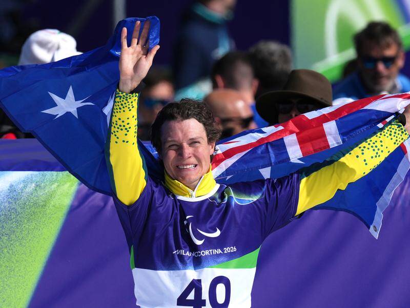 Australian Ben Tudhope celebrates his second medal of the Winter Paralympics in Cortina. Photo: AP PHOTO