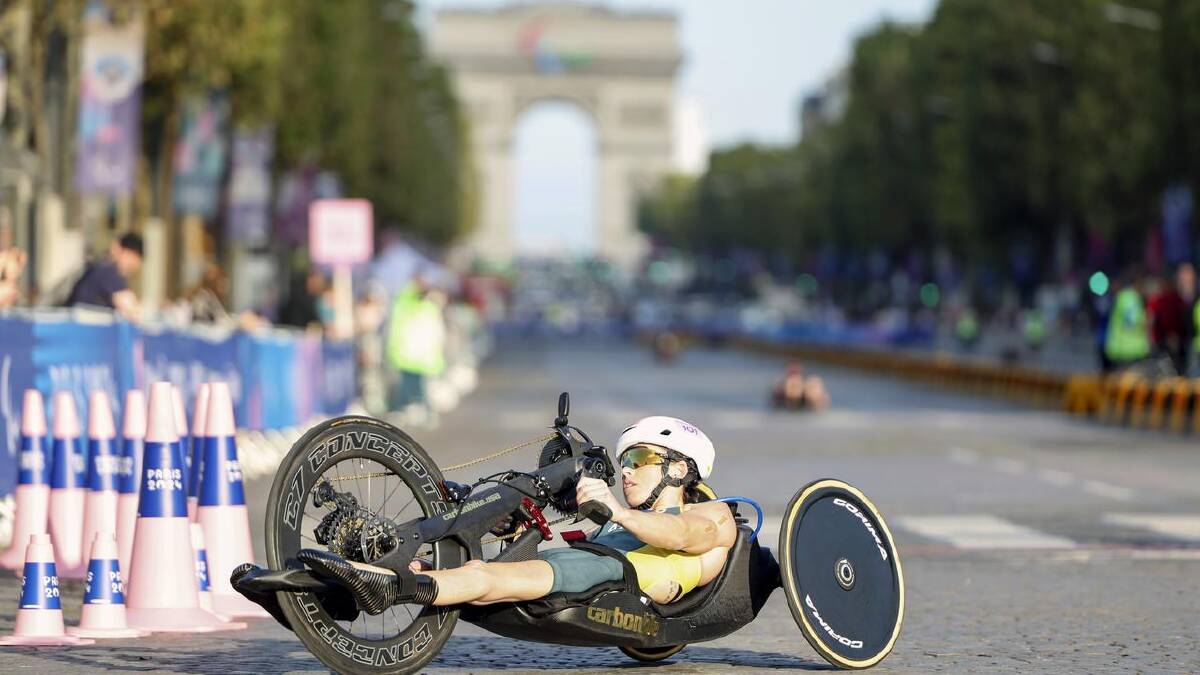 Australian Lauren Parker in summer sport mode, competing in the Paris Paralympics triathlon. (AP PHOTO) Australian Lauren Parker in summer sport mode, competing in the Paris Paralympics triathlon. (AP PHOTO)