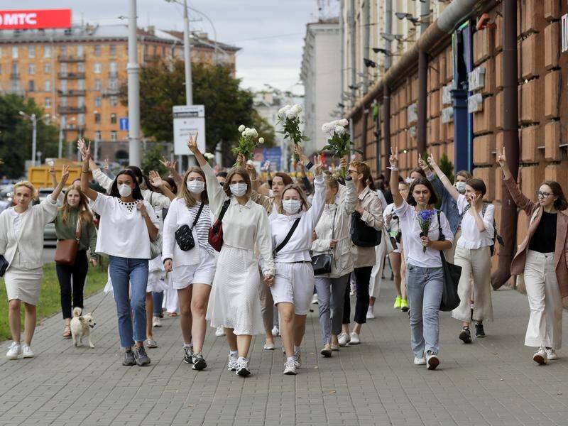 Women protested in Minsk in defiance of a brutal crackdown by Belarus police.