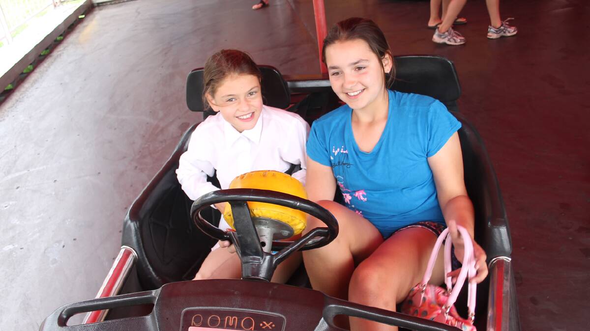  FUN: The dodgem cars were a hit at the Stock Fair with many kids (and big kids!) enjoying a turn. Pictured just after a ride are Victoria Clancy of Cootamundra who competed in the gymkhana earlier in the day and Jessica Lake of Stockinbingal. 