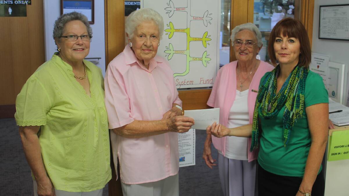 CHEQUE DONATION: Pictured (from left) are Barbara Kelly, Beryl McPhail and Margaret Young from the CWA day branch presenting Nursing Home employee Tracey Watson with a cheque for $1000. The money will be put into the Nursing Home Sprinkler Fund which currently sits at more than $125000.