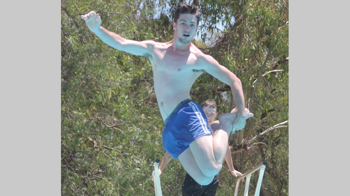 HAVING FUN: Michael Izzard jumps from the diving board at the Town Pool over the weekend. 

Photo: Melinda Chambers 