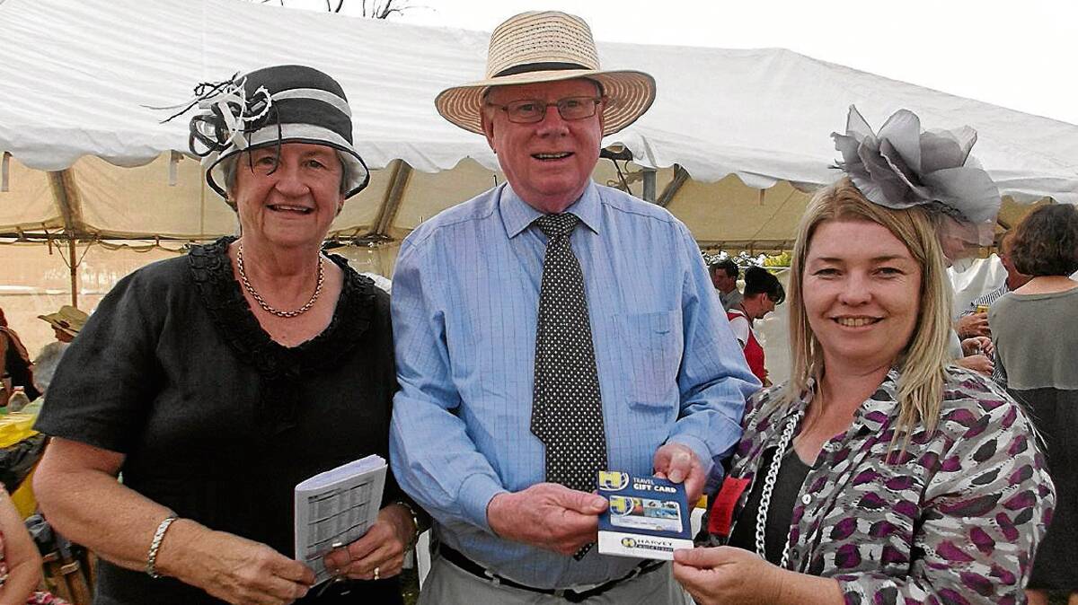 FOUR WEEKS TO GO!
The Annual Cootamundra Picnic Races are set to take place on Saturday, April 5.
The hardworking committee is in ‘full swing’ with preparation for this TOP annual event.
Pictured here at the races last year is committee treasurer Amanda Rosengreen with winners of the travel raffle Peter and Robyn Gain, of Gundagai. The raffle prize for this year’s meeting is once again sponsored by Harvey World Travel and the Southern District Picnic Race Committee. 
