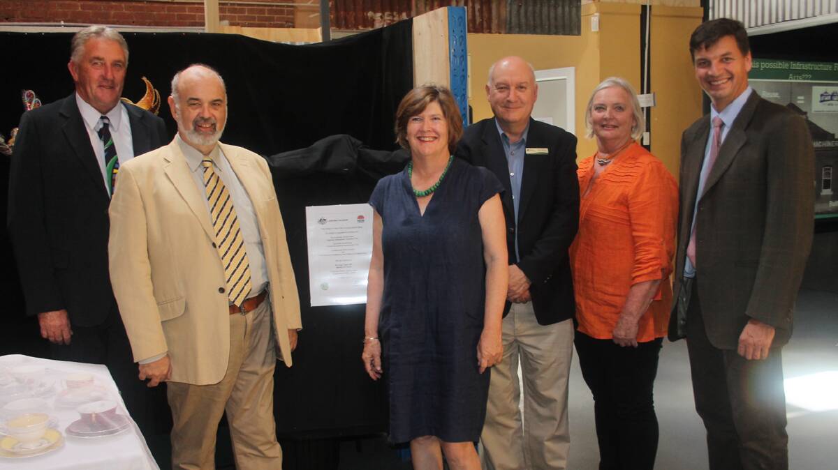 OFFICIAL OPENING: Pictured with the temporary plaque used for the official opening of The Arts Centre are (from left) Deputy Mayor Dennis Palmer, Chairman of the Arts Centre Management Committee Paul Braybrooks, Arts Centre Treasurer Maree Twomey, Regional Development Australia Chair Tom Watson, Arts Centre Volunteer and Visionary Isabel Scott and Member for Hume Angus Taylor. 
