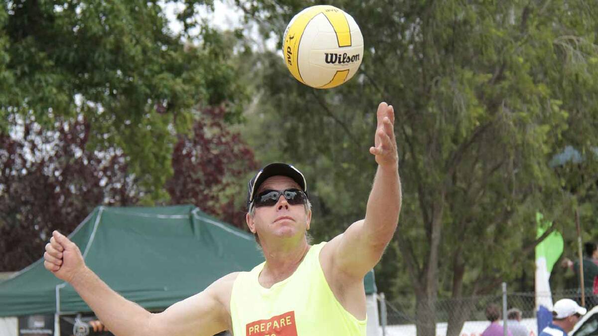 HAVING FUN: Scott Reid serves for the Shire Spikers during the last year’s Coota Beach Volleyball Carnival. The Shire Spikers will be back in action this weekend. 
Photo: Kelly Manwaring 
