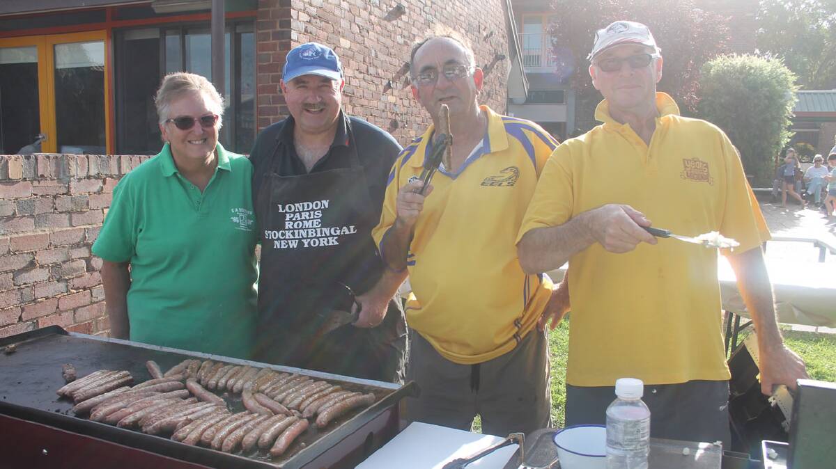 Behind the barbecue: IT wouldn’t be a school fete without a barbecue and no-one went hungry with this dedicated lot holding the tongs at the recent EA Southee Public School fete. 
Pictured (from left) are Marie Wing, Daryl Sedgwick, Kevin O’Dwyer and Larry Wing. 
The fete was loads of fun for attendees and a good fundraiser for the P and C. 
The P and C of EA Southee School will again be in action behind the barbecue at this Saturday’s Cootamundra Picnic Races. 