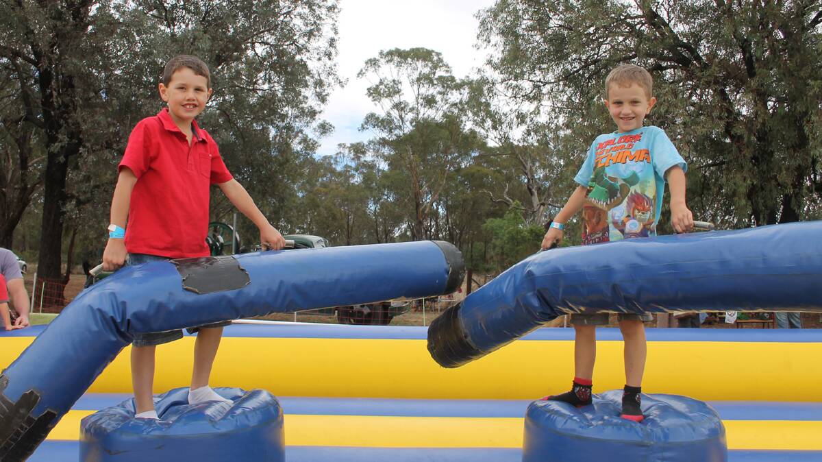 BOYS BEING BOYS: Having a turn at the gladiators-style game were cousin Toby Tanks of Cootamundra and Kayden Smart of Stockinbingal. This game was a hit amongst fair-goers. 