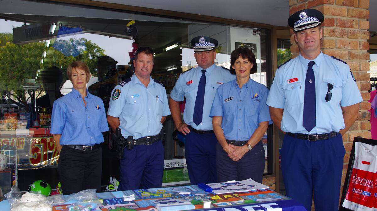 MEETING THE PUBLIC: Volunteer in Policing officer Lindy Boshoff, Cootamundra Local Area Command Crime Prevention Officer Peter Guthrie, Detective Acting Superintendent Paul Huxtable, Volunteer in Policing officer Louanda Hardie and Inspector Frank Brown manned a stall in Parker Street yesterday to engage with the public. 

