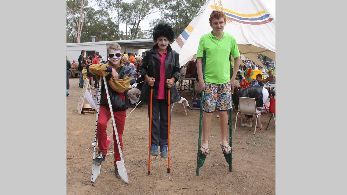 DOING A GREAT JOB: The CADAS Kids are a hit wherever they go and on Sunday at Stock Fair did an awesome job face painting and with their performance pieces. Stilt walkers were (from left) Sam Willis, Dylan Jomantas and Campbell Cooper-Duck. 