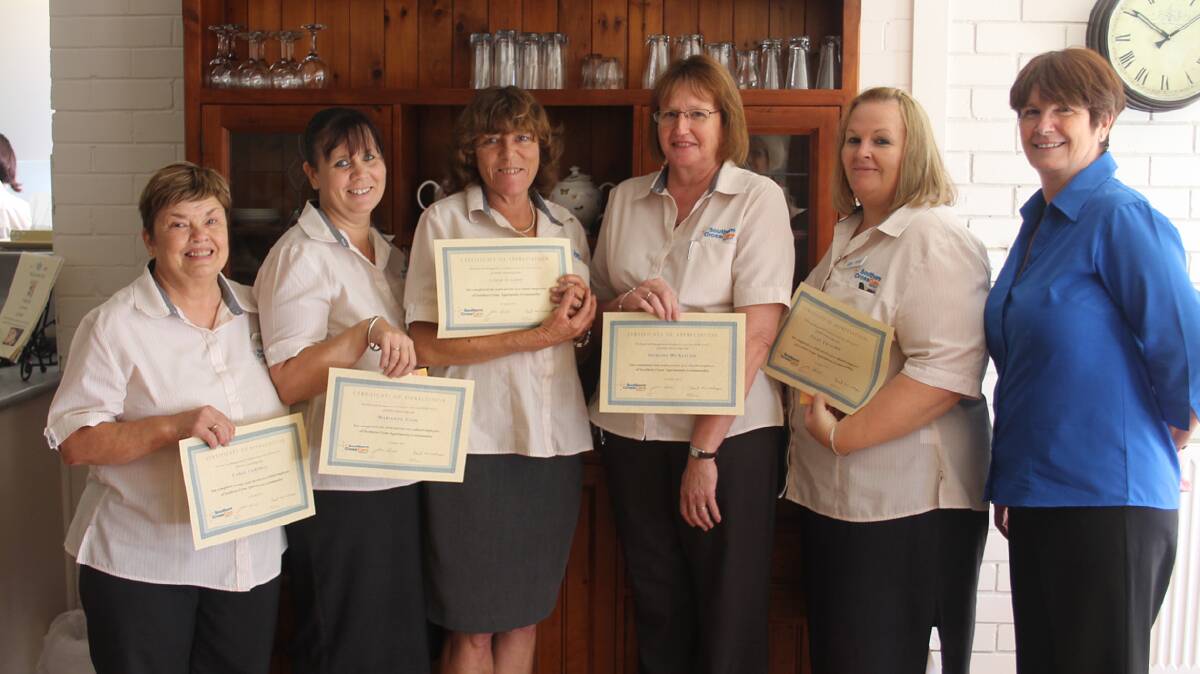 IN HONOUR: Pictured with their long service certificates are (from left) Carol Campbell, Marianne Cook, Leigh Cassidy, Deirdre McAlister, Vicki Twyford and Southern Cross Care area manager Debbie Churchill.