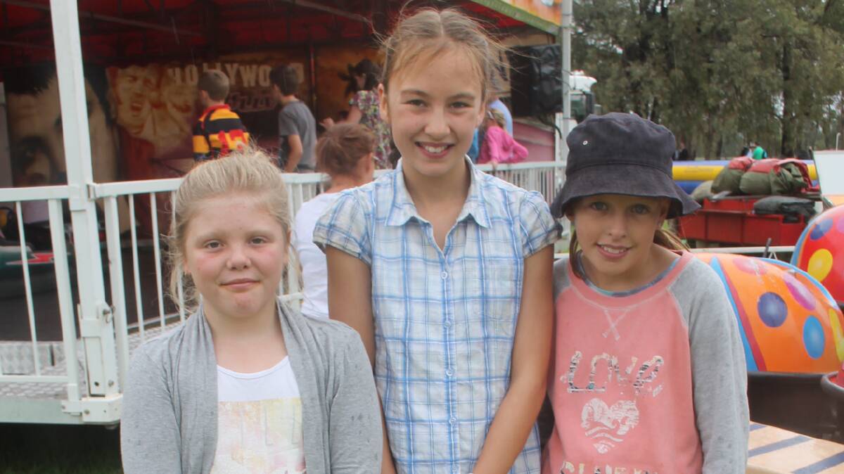 ENJOYING THE RIDES: Making the most of the rides at Sunday’s Stock Fair were Alissa Stewart of Cootamundra, Sophie Lyne of Cootamundra and Ellah O’Callaghan of Stockinbingal. 