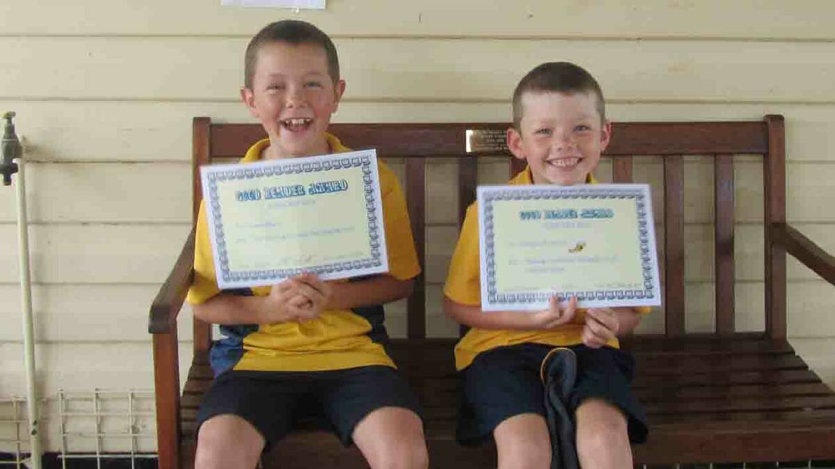 GOOD READER OF THE MOTH: Nathan Bowditch (left) and Adam Mayor were recipients of Stockinbingal Public School’s special awards.
