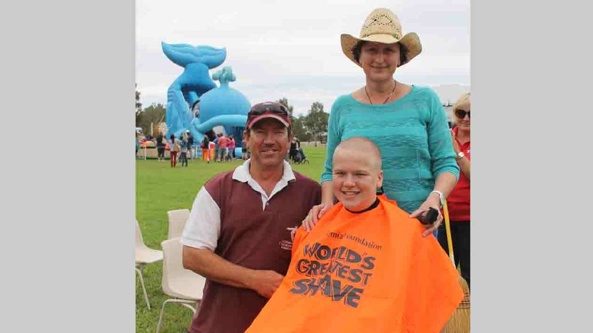  FABULOUS FUNDRAISER: Stockinbingal’s Luke Annetts is pictured with parents Mark and Kylie at Stock Village Fair on Saturday after raising more than $1500 for the Leukaemia Foundation as part of Shave for a Cure. It was a highlight of a terrific fair day. See full story on Stock Fair on page four of today’s Herald. 
