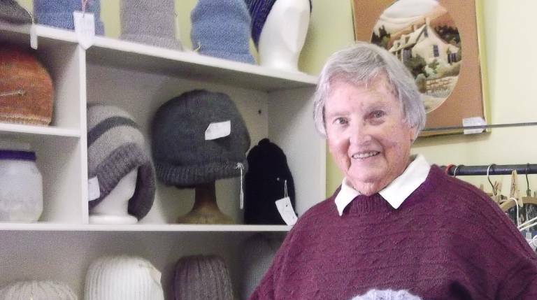 DAD'S DAY: Joyce Orgill with some of the hand-knitted beanies at the Cootamundra Art and Craft Centre. Picture: Bernadette Wilson