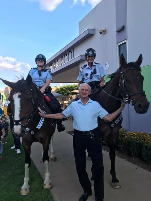 DELIGHTING ALL: Here pictured are the NSW Mounted police here in town for the Beach Volleyball weekend, together with local man Don (Banjo) Paterson.