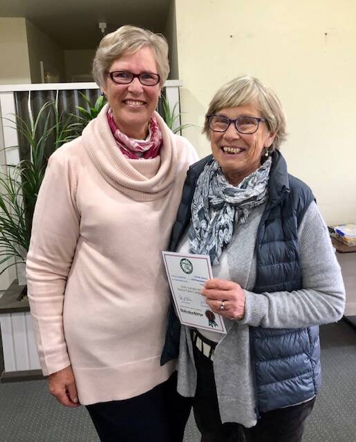 WELL DONE: Jane Storey who organises Tuesday play (left) with Cathie Bragg after she was presented with her certificate for the Australia-wide novice event.