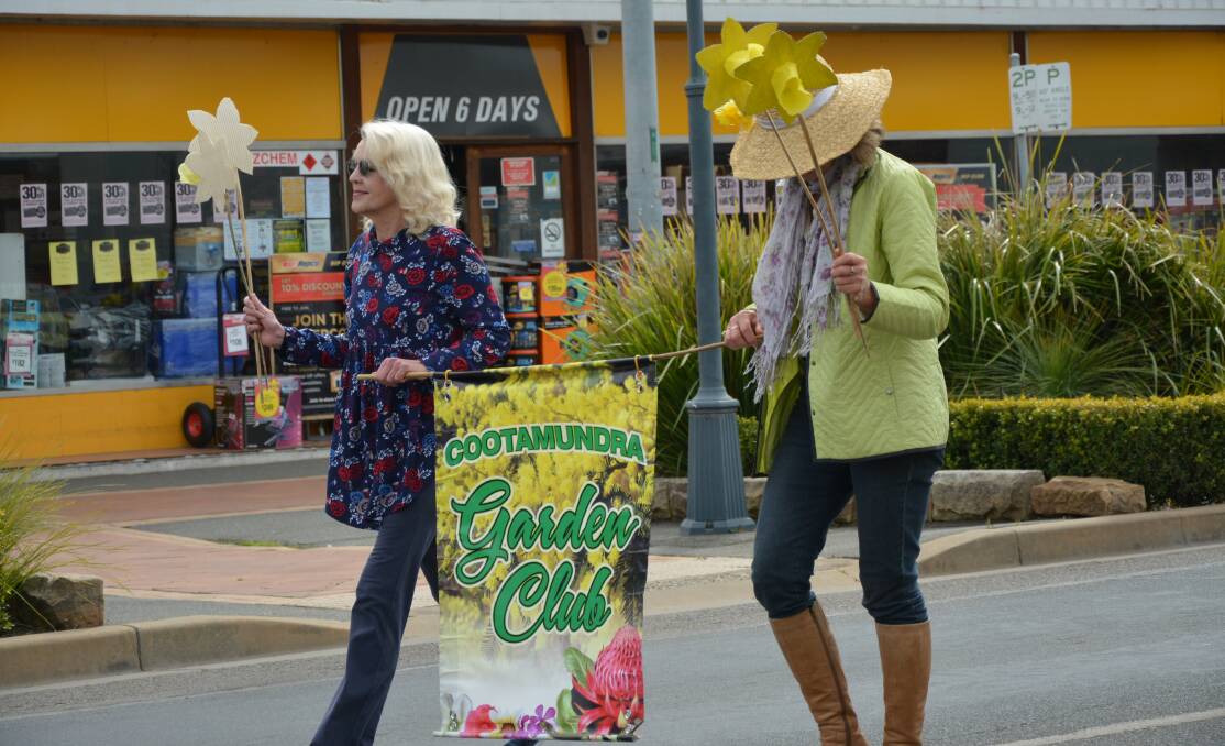Marching on: Cootamundra District Garden Club members take part in the Wattle Time Parade. Photo: Supplied