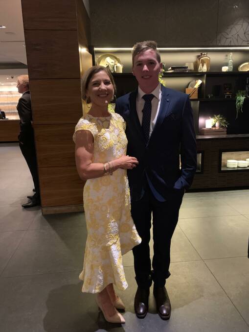 GRADUATION: Proud mum Jacky Sheahan with her son Sam at his recent Year 12 Graduation from St Gregory's Marist College, Campbelltown. Dressed by Jack & Jill. 