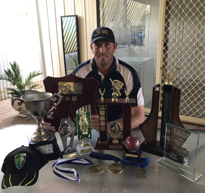 CLEAN BOWLED: Dean Bradley with the awards he received for his outstanding performances in local and representative cricket, including the bowling aggregate and average award and a gong for lead wicket-taker.