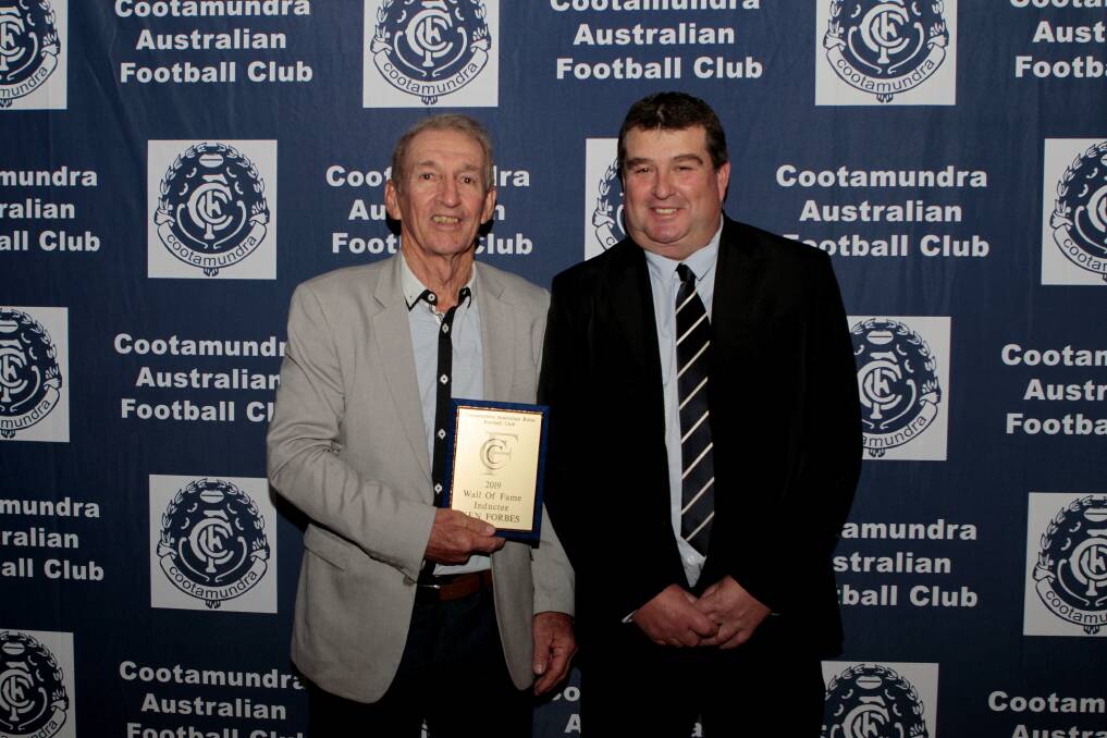 TRUE BLUE: Former Coota Blues coach and player Ken Forbes with club president Todd Basham was added to the Cootamundra Australian Football Club's Wall of Fame.