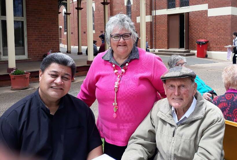 SUCCESSFUL: Sacred Heart Church Parish priest Fr Lolesio pictured with Cathy OBrien and Ted O'Connor at the highly successful Parish Day barbecue held on Sunday last in the grounds of the Presbytery.