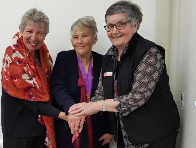 OCCASION: Cootamundra Hospital Auxiliary patron Jenny McClintock cuts the cake with president Janice Slattery and UHA state president Linda Swales. Picture: SUPPLIED