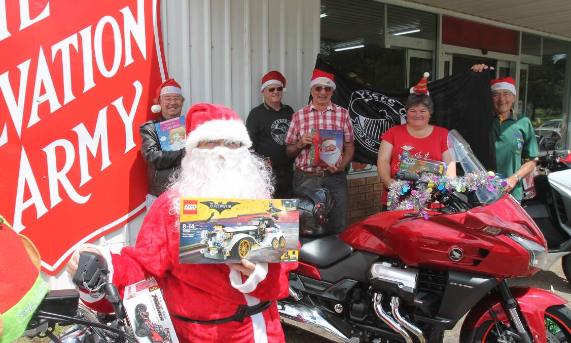TOYS AND TOYS: Santa Claus with his helpers Daryl Shoard, Lyell Jenkins, Ed Hamilton, Kate O'Brien and Bill Teale. Photo: Declan Rurenga