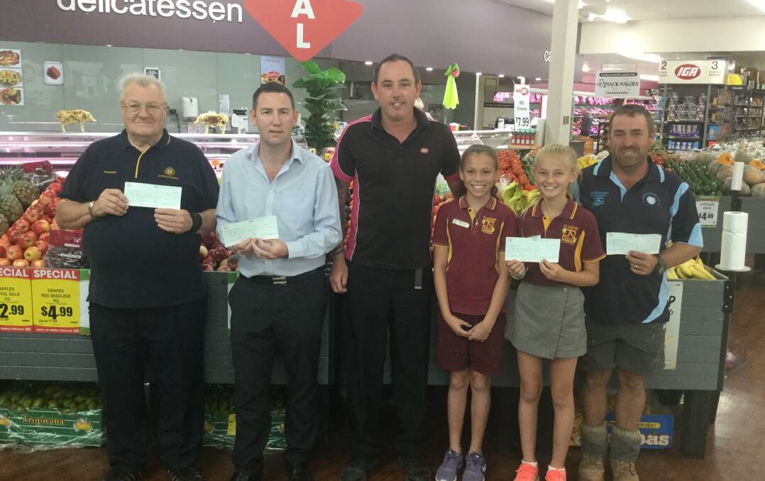 DONATION: Francis Elmes, Alex McKennon, IGA store manager Daniel Wells, EA Southee Public captains Kerstyn Taylor, Lilliana Chick and Andrew Parkinson.