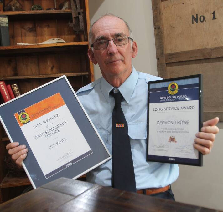 RECOGNITION: Cootamundra SES controller Des Rowe with this life membership and 50 years' service awards on Saturday. Photo: Declan Rurenga