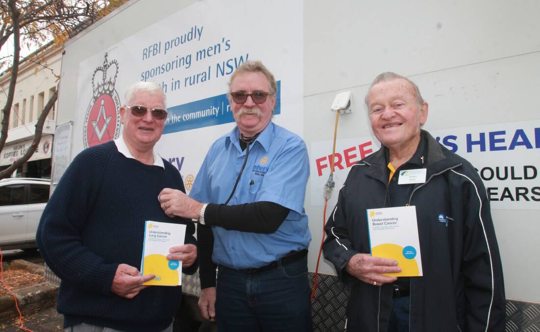 CHECK-UP: Ron South, Rob Woolley and Cootamundra Rotary volunteer Father Bill Pryce with MHERV on Parker Street. 