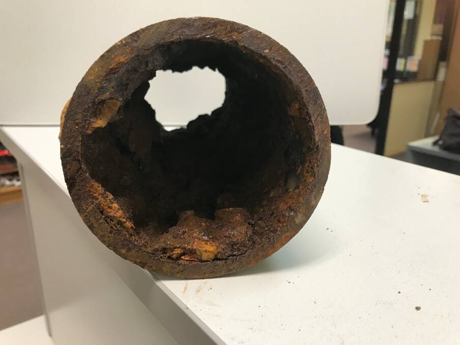 A rusty water pipe.