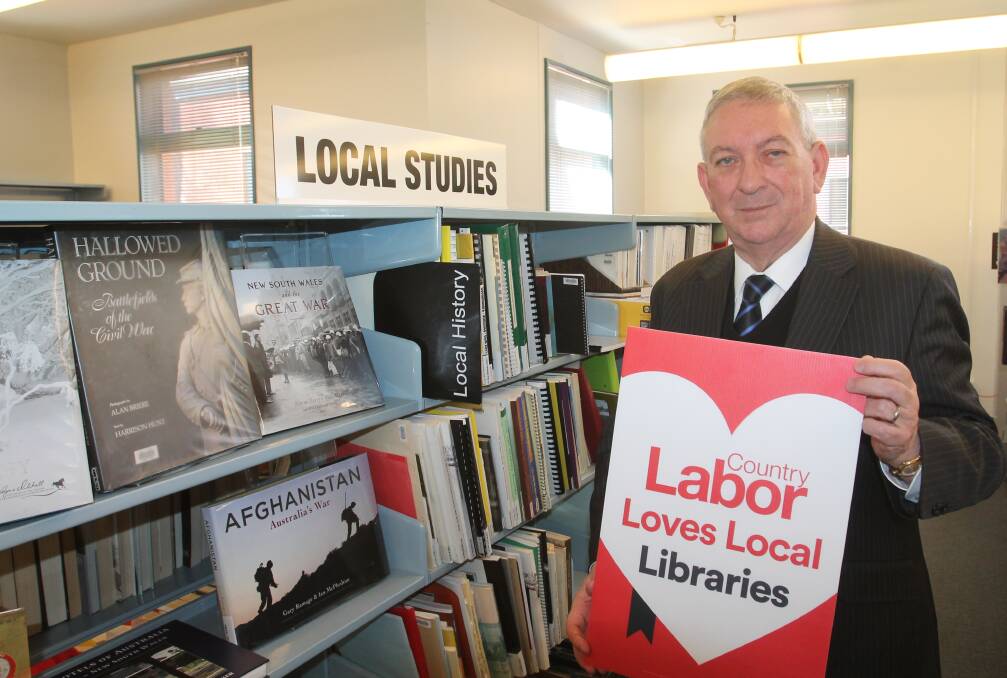 FUNDING PROMISE: NSW opposition local government spokesman Peter Primrose visiting Cootamundra Library. Photo: Declan Rurenga