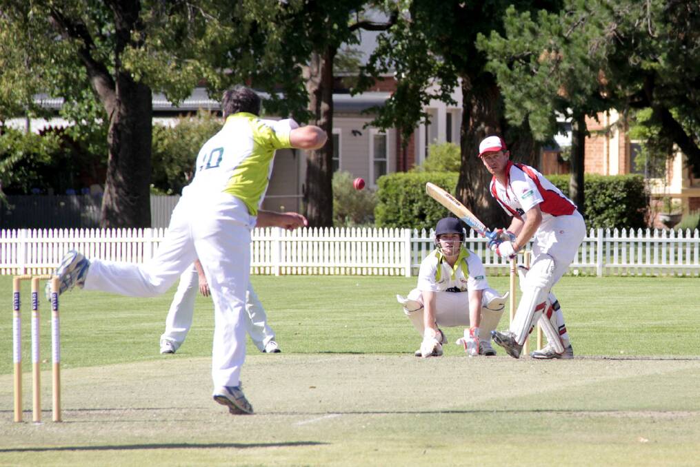 Brendan Gale faces bowler Ray James while keeper James Smith watches. Photo: Kelly Manwaring