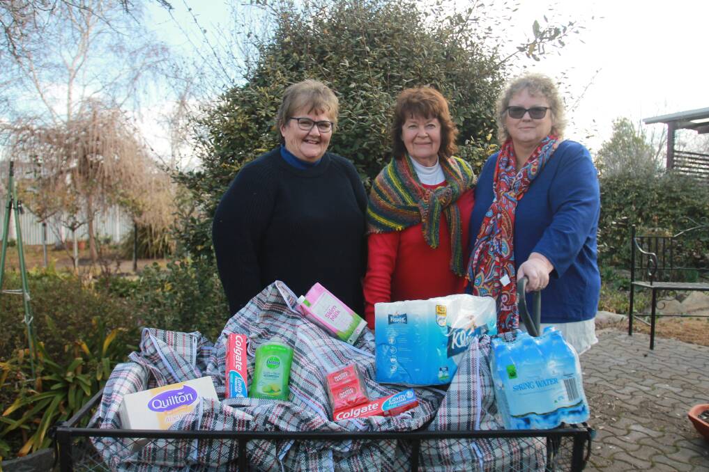 SPECIAL DELIVERY: Cathy O'Brien, Gloria Schultz and Anne Gammon are preparing care packages for farmers. Photo: Declan Rurenga