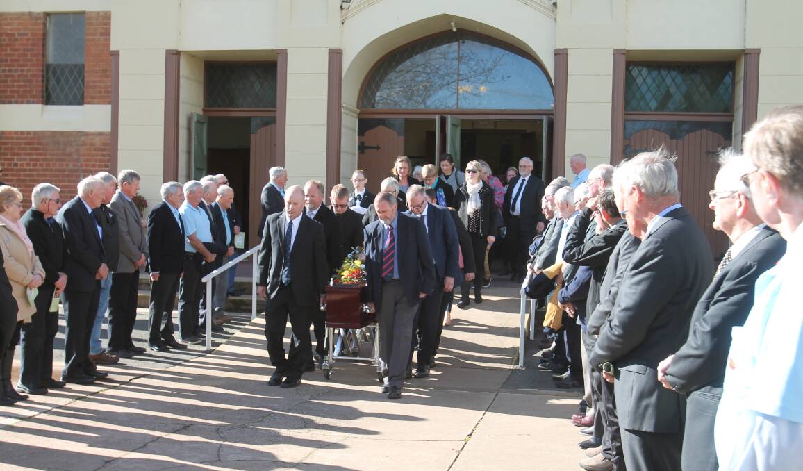 REMEMBERED: A guard of honour formed by Cootamundra's Veteran Golfers outside Sacred Heart Church. Photo: Declan Rurenga