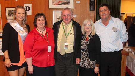 AMAZING EFFORT: 2013 Miss Wattle Amanda Ingham is pictured with Can Assist volunteers (from left) Tammy Thompson, Neil Murray, Maryanne Izzard and Murray Izzard during the Wattle Time Art Exhibition opening. 