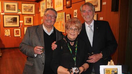 FAMILY CONNECTION: Cootamundra’s Meg Smith is pictured with her cousin Graham Simpson (left) and his good friend Frank Ifield. Frank was a hit as guest speaker at the opening of the art show. 